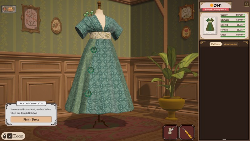 A green patterned dress with floral decorations on a mannequin in Dressmaker